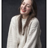 Maddie Senior Studio Portrait with Sweater and Black Background